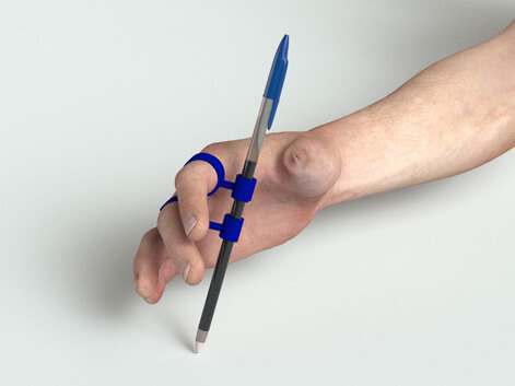 The Grippit, A durable pen grip for right and left handed use