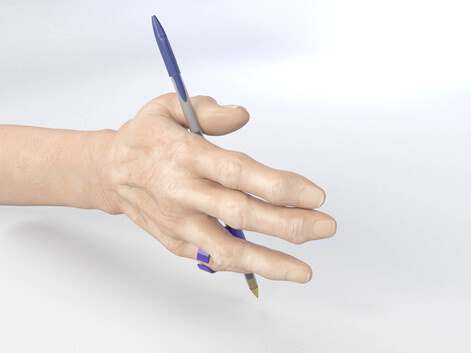 The Grippit, A durable pen grip for right and left handed use.